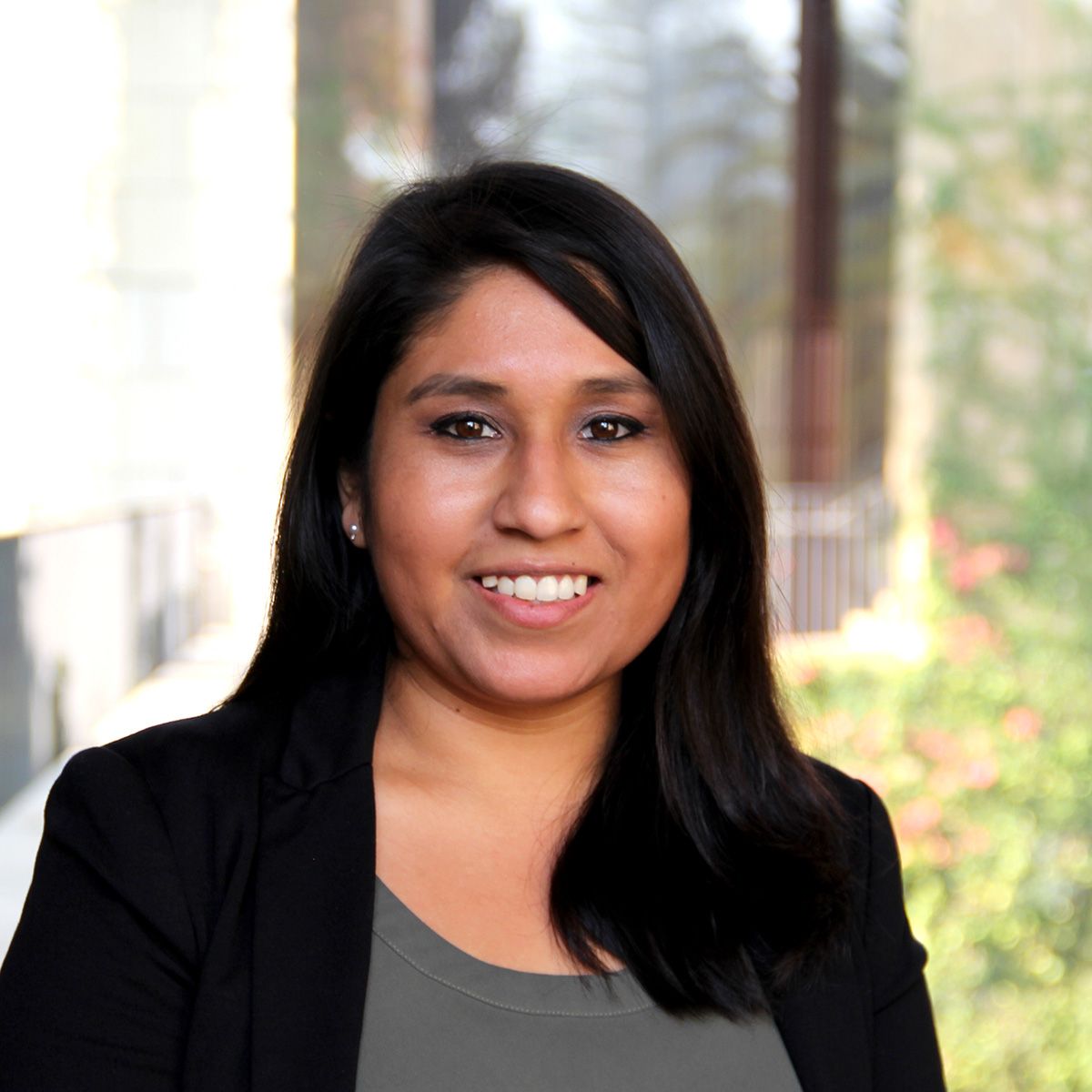 liz sanchez, a young hispanic woman with long brown hair and a nice smile